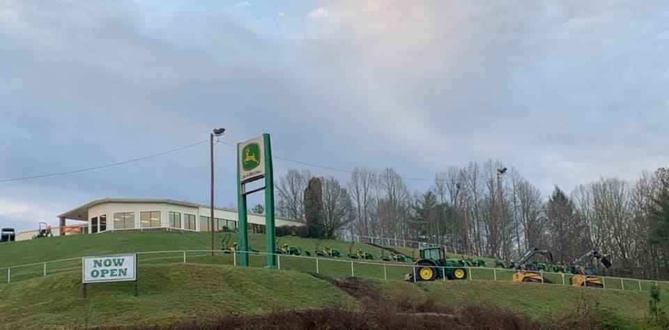 An outside photo of an Ag-Pro location with a sign in front that reads "Now Open."