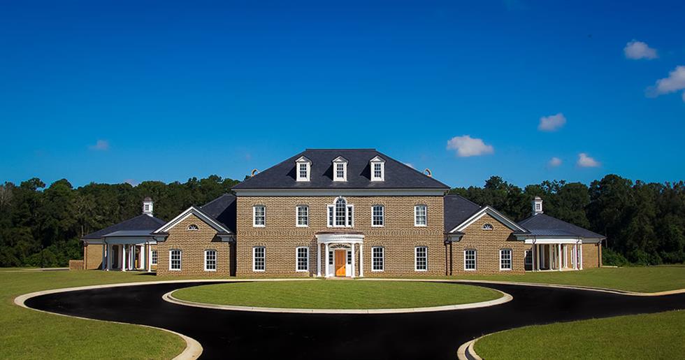 The Ag-Pro corporate headquarters is pictured with a blue sky.