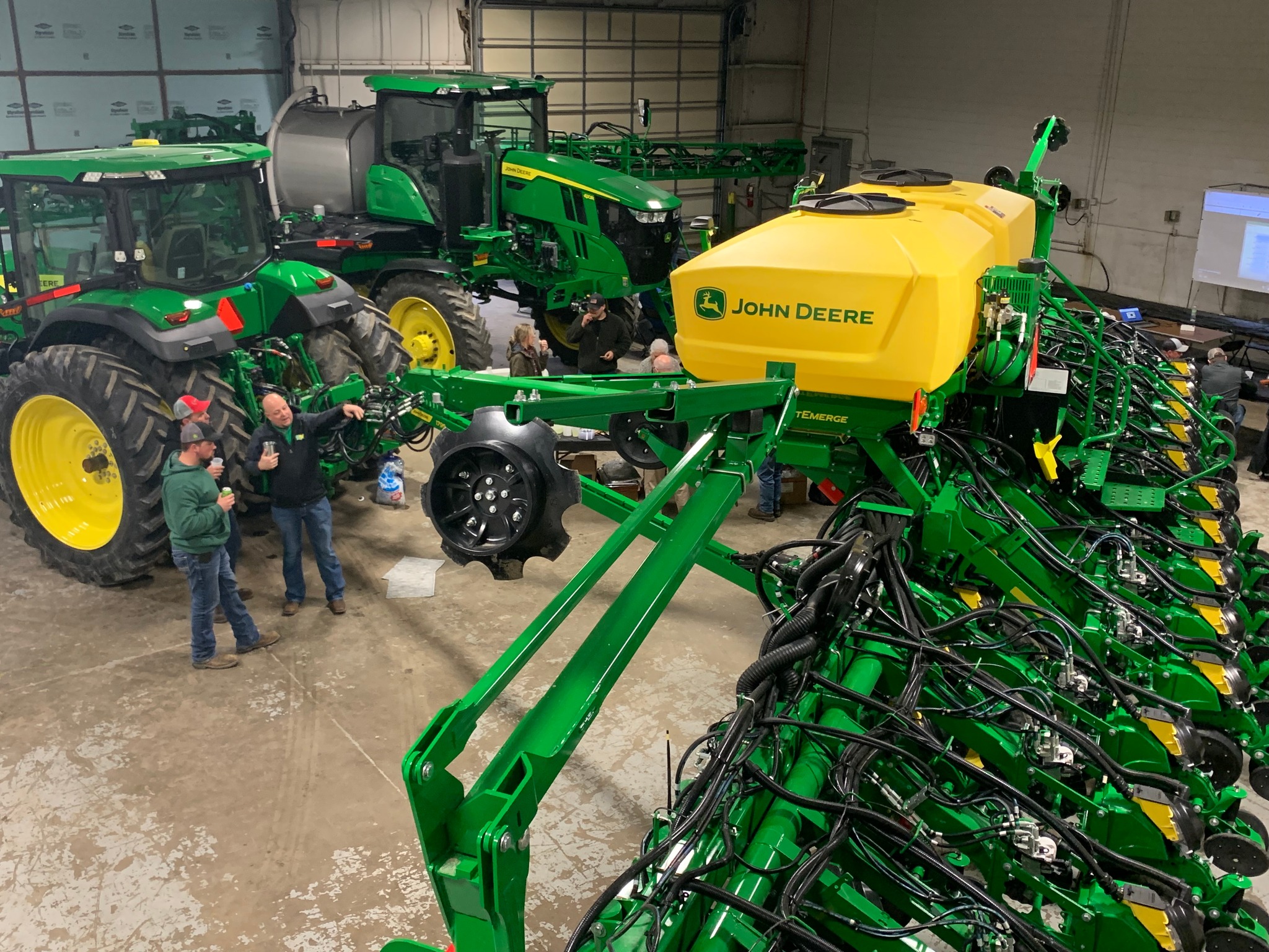 Ag-Pro customers view John Deere equipment at a Spring Clinic.