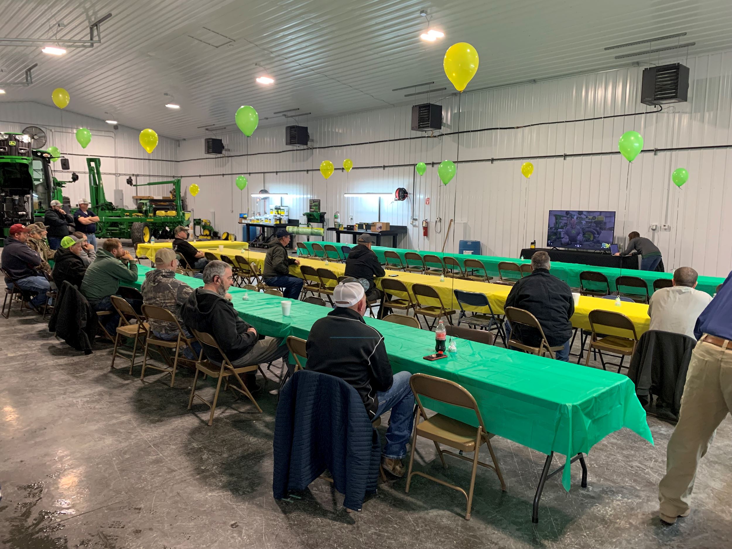 Ag-Pro customers sit at tables in prep for a presentation. 