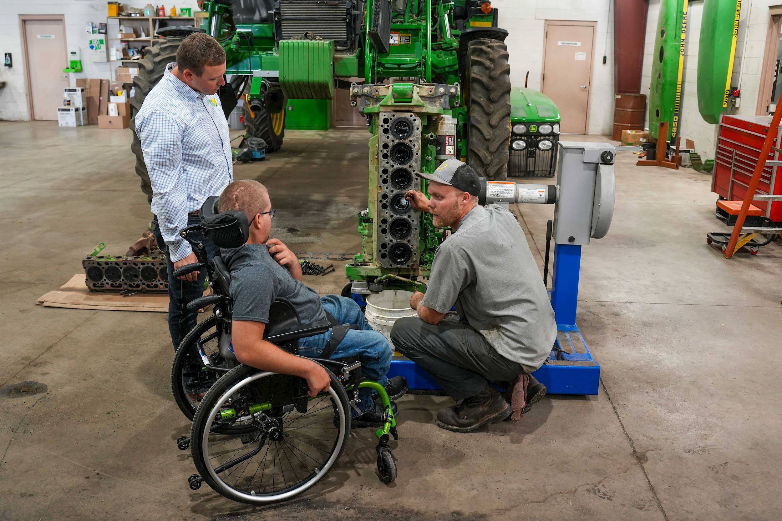 Noah Wyatt talking with Ag-Pro employees