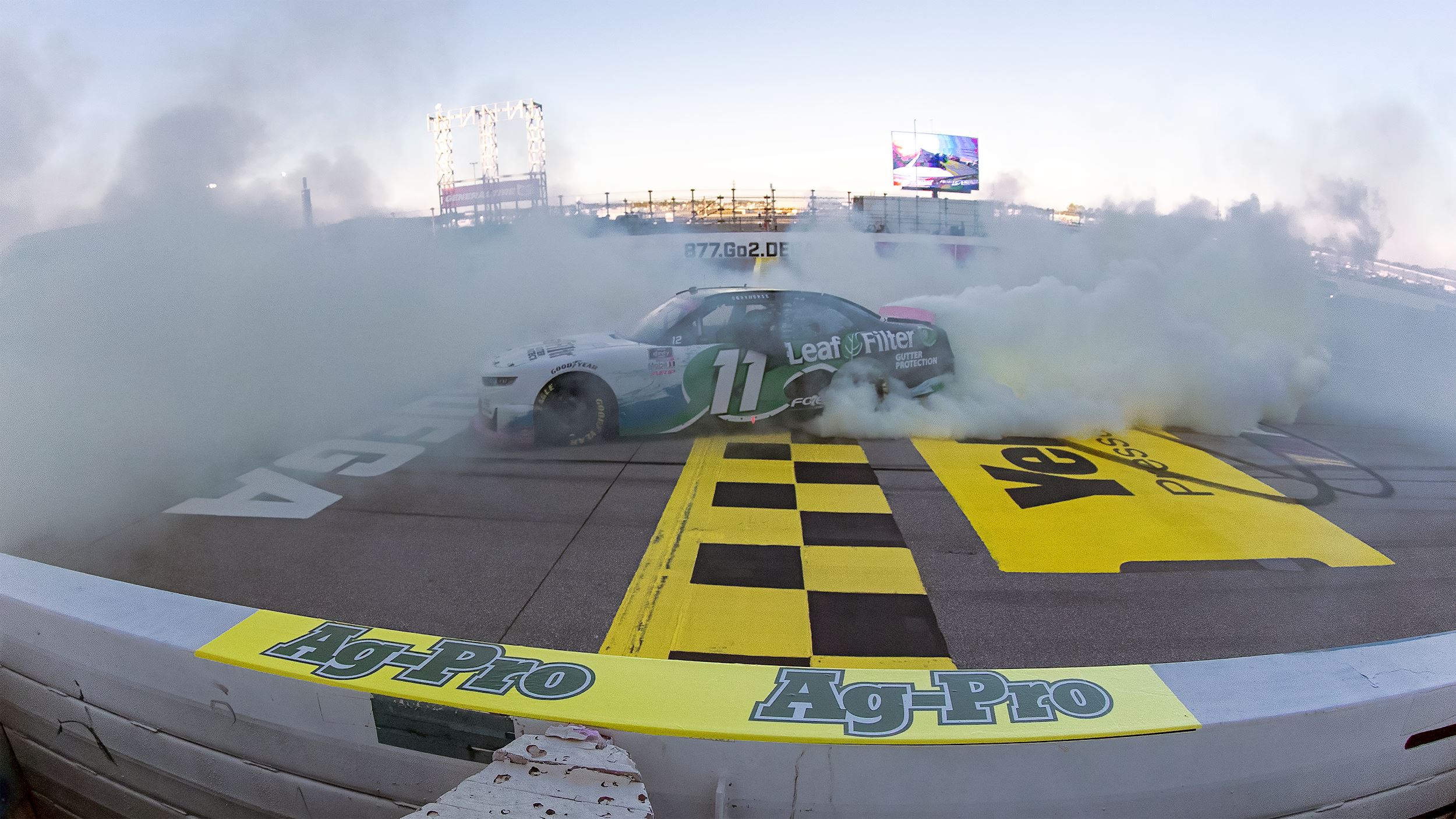 A race car spins out, creating smoke at the Ag-Pro 300. 