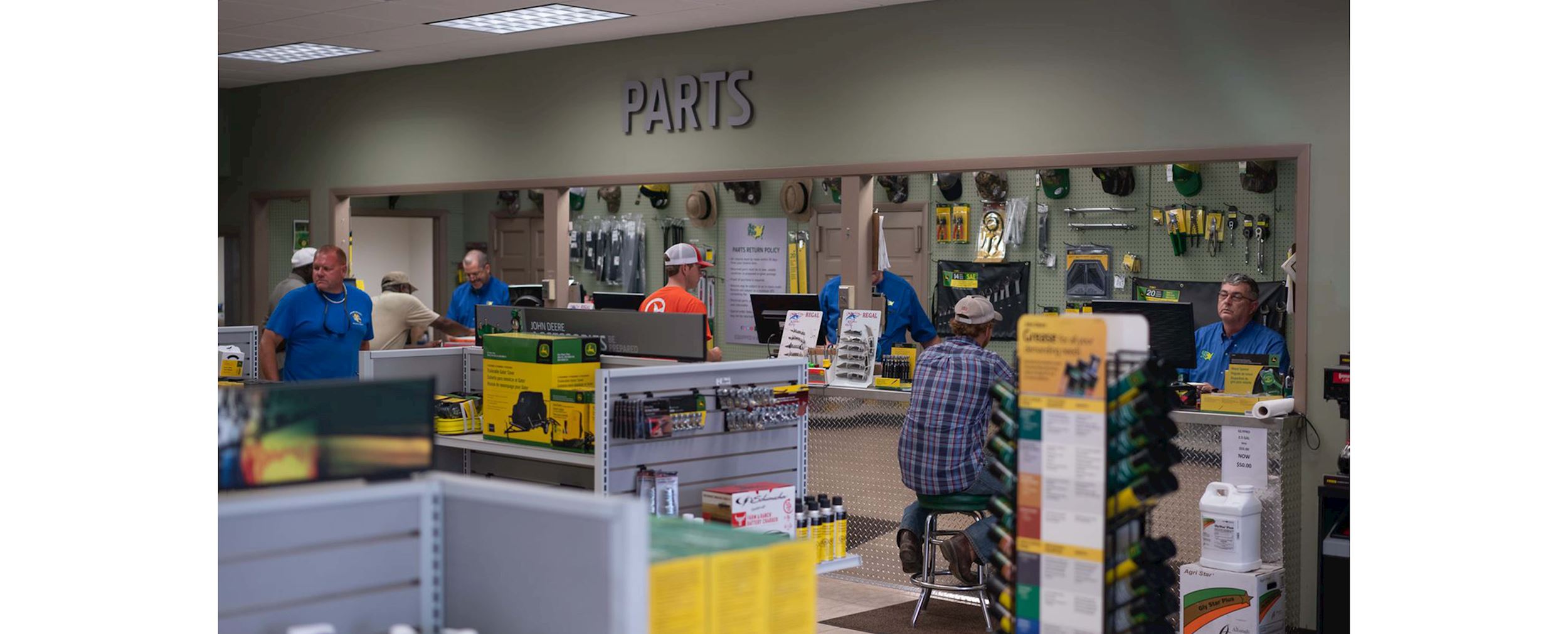 Images features the interior of an Ag-Pro John Deere store. The word "parts" is displayed.